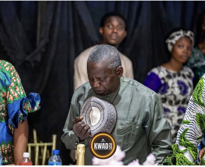 Elderly man praying at Zaria KWAD